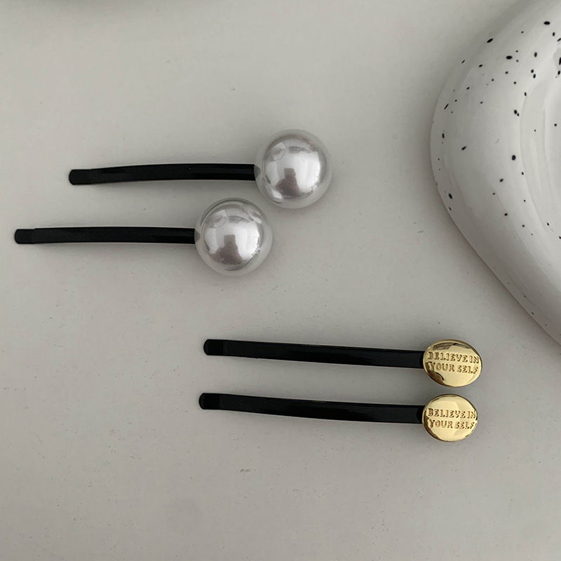 Pince à cheveux en forme de ba - Head Racket Boom avis et prix
